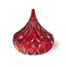 Red glass vase with diamond cut pattern on a white background