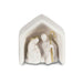White nativity scene figurine with gold accents inside a hexagonal stable on a white background