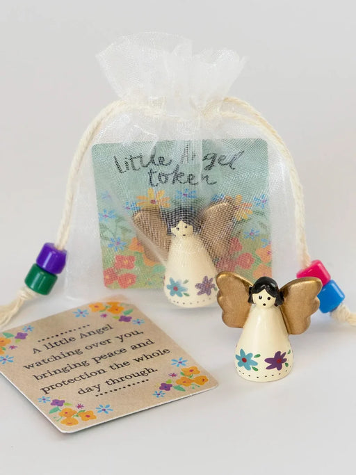 Decorative angel token with a tag on a white background
