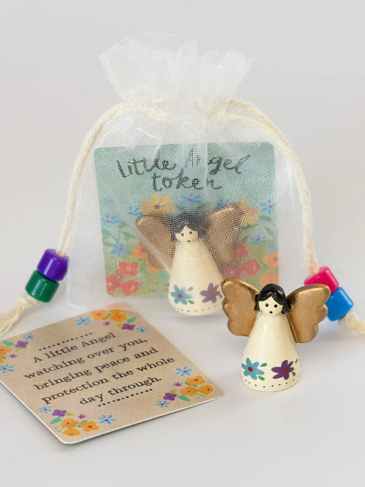 Decorative angel token with a tag on a white background
