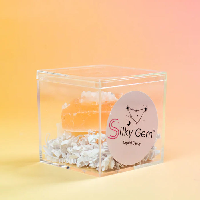 Clear cube container with a crystal candy and 'Silky Gem' label on a gradient background