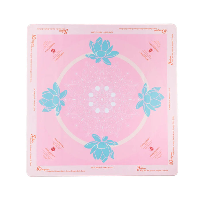 Pink mat with teal lotus pattern on a white background