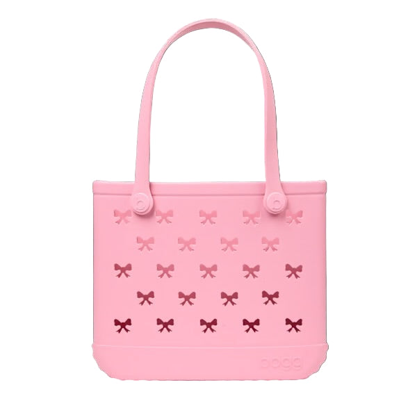 Pink tote bag with bow pattern on a white background