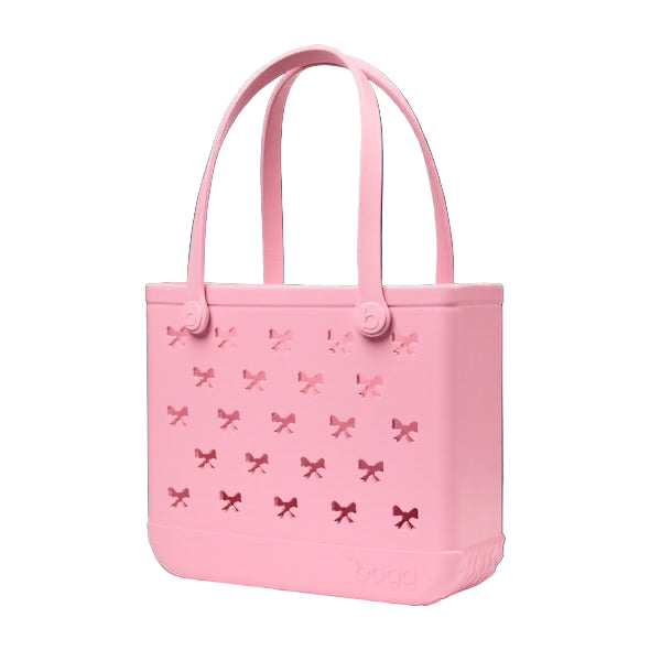 Pink tote bag with bow pattern on a white background