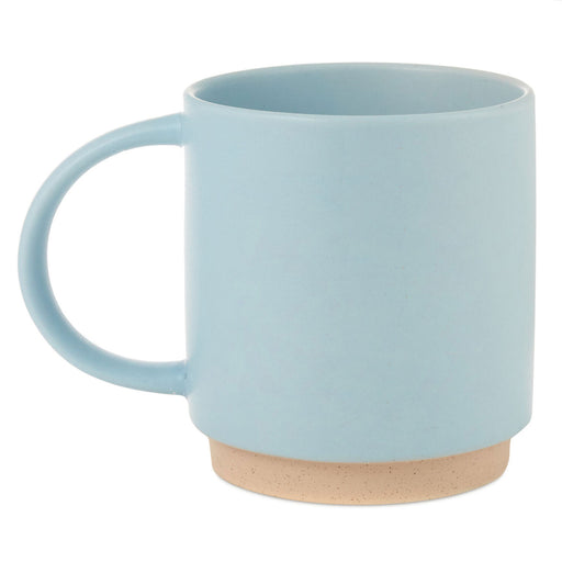Light blue mug with a wooden base on a white background
