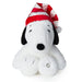 Plush toy resembling a dog with a red and white striped hat on a white background