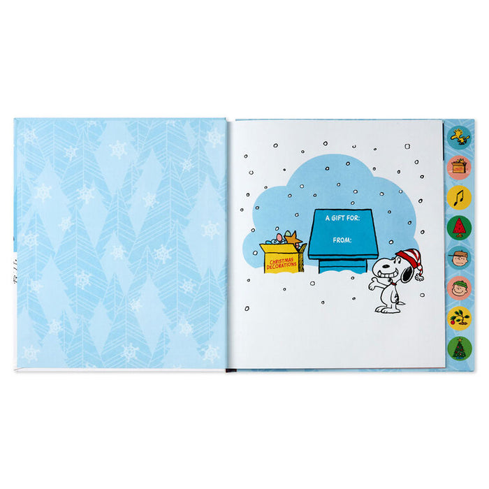 Open book with a Christmas-themed illustration of Snoopy and a gift box on a blue snowy background.