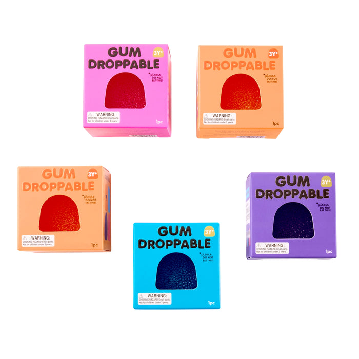 Five packages of Gum Droppable on a white background