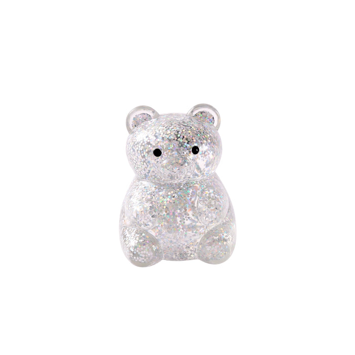 Sparkly bear-shaped charm on a white background