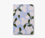 Notebook with floral design on a light blue background