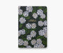 Floral notebook with white flowers on a dark green background