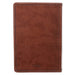 Brown leather notebook with visible brand logo on a white background