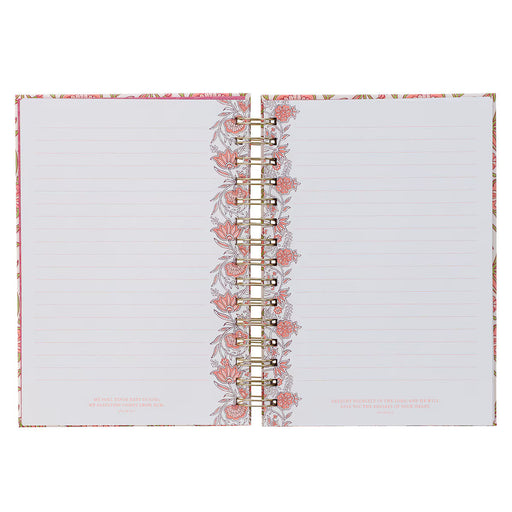 Open notebook with floral design on a white background