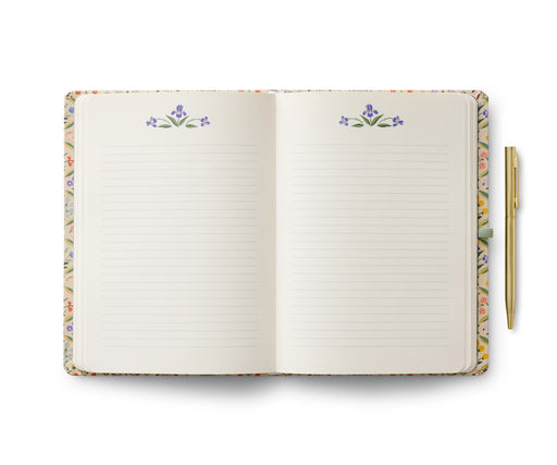 Open notebook with floral design on the cover and edges, on a white background