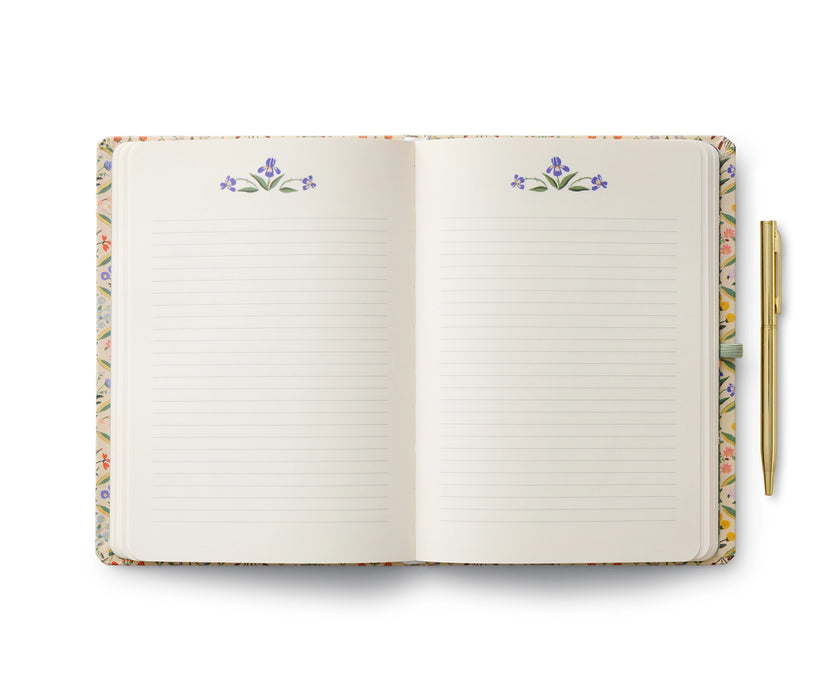 Open notebook with floral design on the cover and edges, on a white background