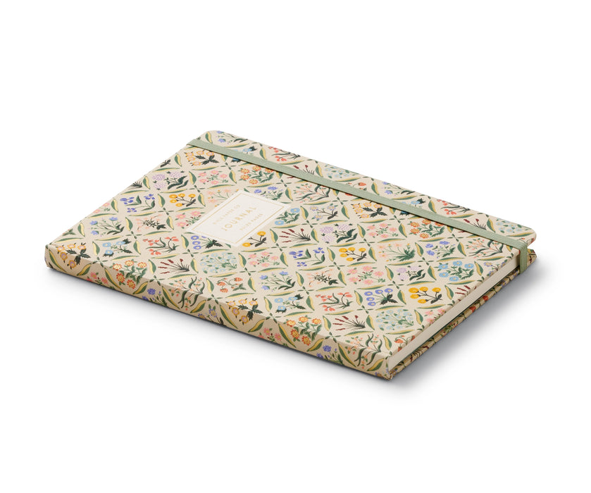 Floral patterned notebook on a white background