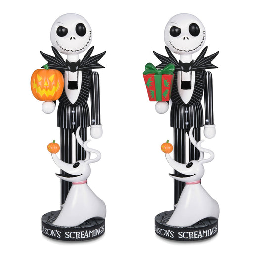 Two Jack Skellington and Sally nutcracker figurines from Disney's The Nightmare Before Christmas, shown side by side on a white background. The left figure holds a carved jack-o'-lantern, and the right figure holds a red Christmas gift with green wrapping paper.