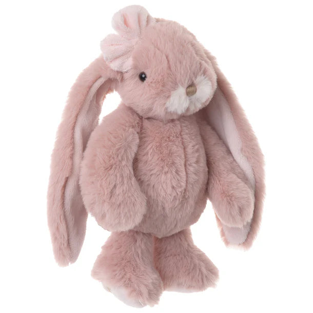 Pink plush bunny toy with a bow on a white background