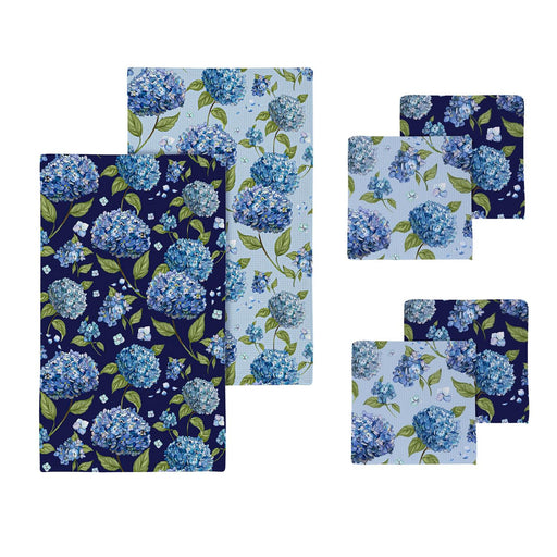 Set of blue floral-patterned towels on a white background