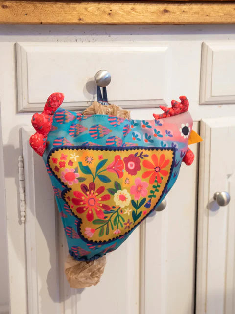 Colorful chicken-shaped So Cute Grocery Bag Holder on a white door