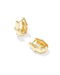 A pair of gold huggie hoop earrings with a textured, geometric bamboo-inspired design and a small orange accent, shown on a clean white background.