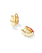 A pair of gold huggie hoop earrings with red enamel accents, displayed on a clean white background.