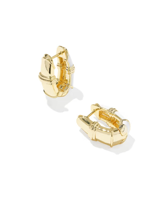 A pair of gold huggie hoop earrings with a textured, segmented design, displayed on a clean white background.