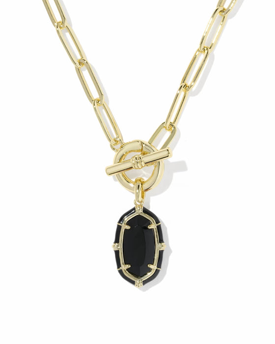 A gold paperclip chain necklace with a toggle clasp and a small oval black onyx pendant, shown on a plain white background.