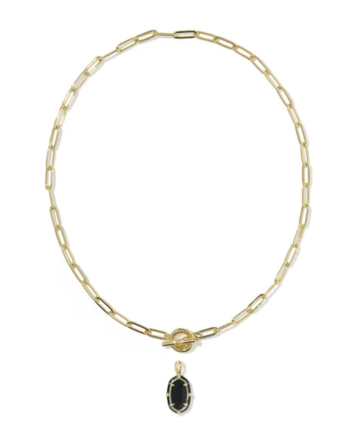 A gold paperclip chain necklace with a toggle clasp and a small oval black onyx pendant, shown on a plain white background.