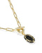 Gold paperclip chain necklace with a toggle clasp and a black oval pendant with gold bezel detailing, shown on a white background.