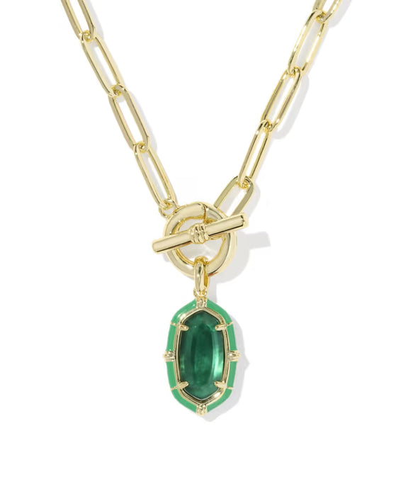 A gold paperclip chain necklace with a toggle clasp and a green emerald-cut pendant, shown on a clean white background.