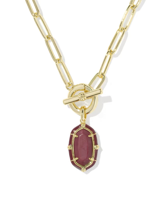 Gold necklace with a teardrop-shaped diamond pendant on a white background