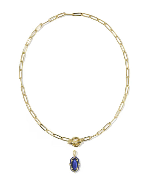 A gold paperclip chain necklace with a toggle clasp and a small oval blue gemstone pendant, shown on a plain white background.