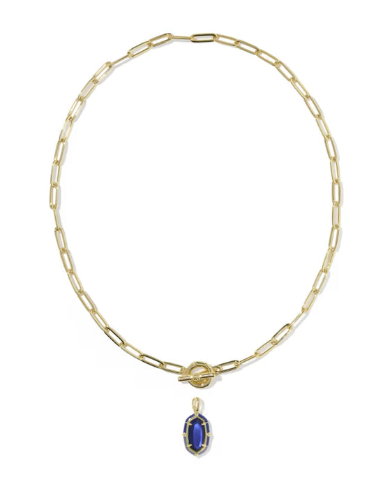 A gold paperclip chain necklace with a toggle clasp and a small oval blue gemstone pendant, shown on a plain white background.