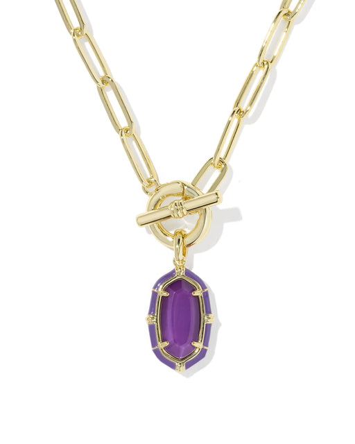A gold paperclip chain necklace with a toggle clasp and a purple oval gemstone pendant, shown on a clean white background.