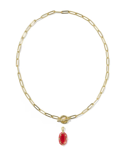 A gold paperclip chain necklace with a toggle clasp and a dangling red oval gemstone pendant, shown on a plain white background.