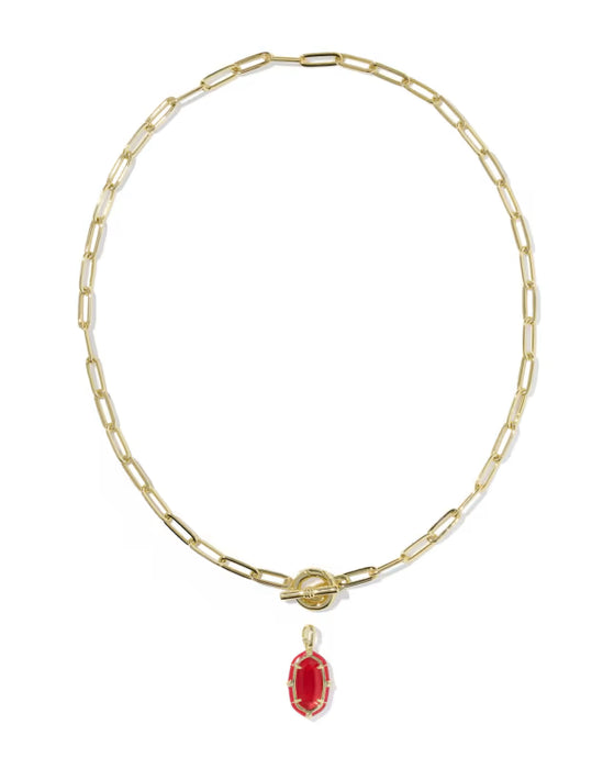 A gold paperclip chain necklace with a toggle clasp and a dangling red oval gemstone pendant, shown on a plain white background.