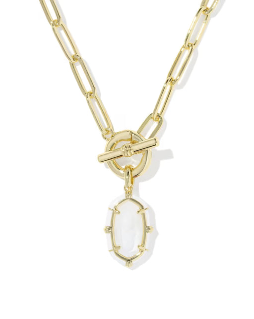 A gold paperclip chain necklace with a toggle clasp and a dangling oval white stone pendant, shown on a clean white background.