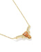 A gold chain necklace with a pendant shaped like a longhorn steer head, featuring a textured orange stone and small clear crystals, shown on a white background.