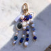 Decorative keychain with beads and tassel on a marble surface