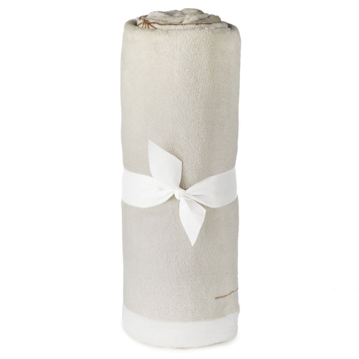 Rolled-up towel with a white bow on a white background