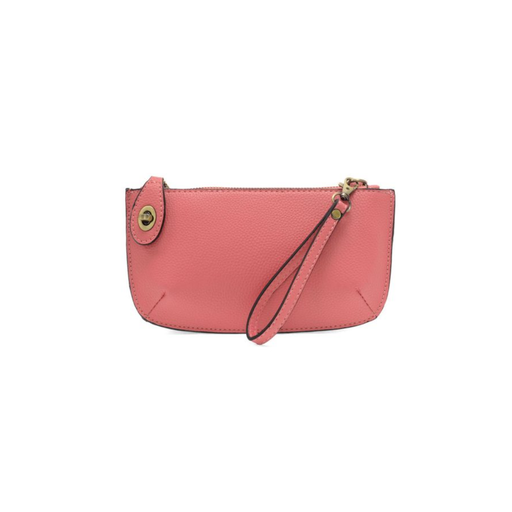 Pink wristlet purse with a strap on a white background
