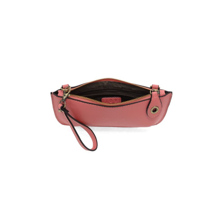 Pink leather clutch with a strap on a white background