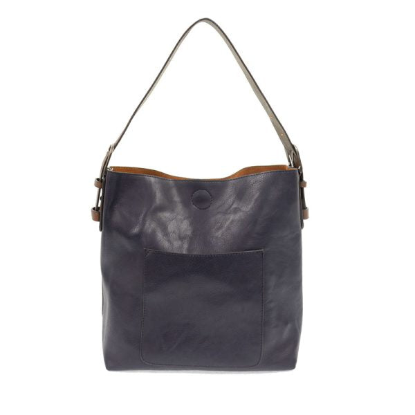 Dark blue leather handbag with a shoulder strap on a white background