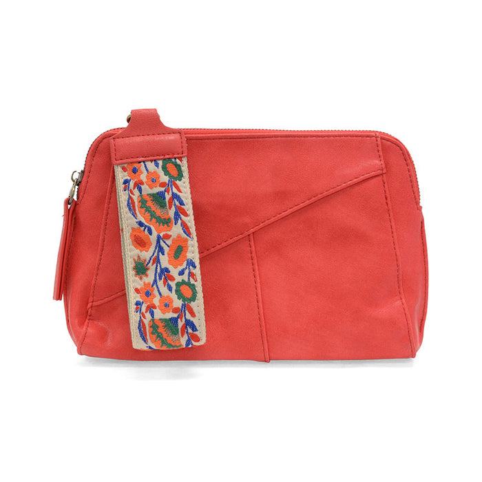 Red pouch with floral embroidery on a white background