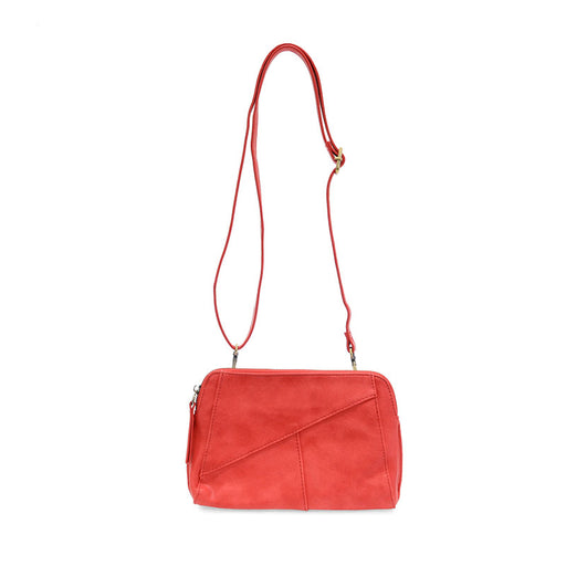 Red handbag with a strap on a white background