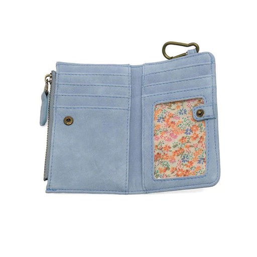 Light blue wallet with floral pocket on a white background