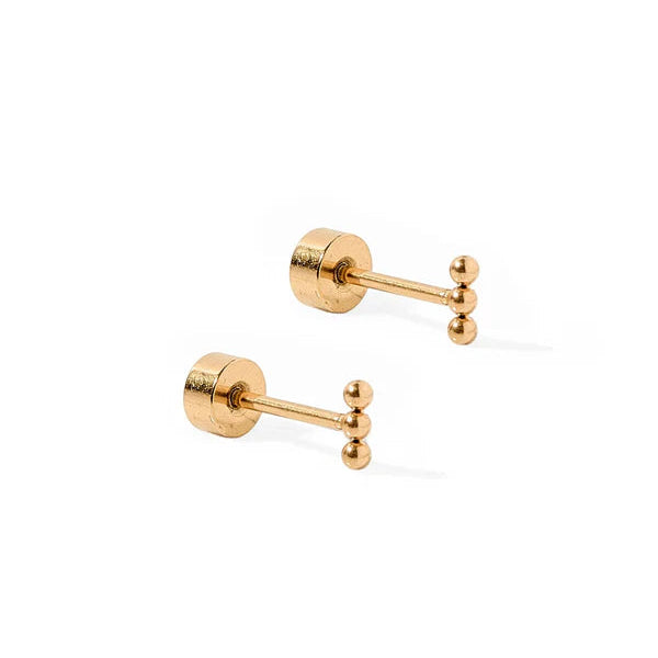 Pair of gold stud earrings on a white background