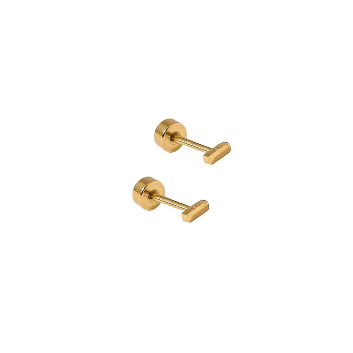 Two gold earrings on a white background