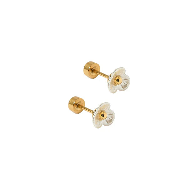 Pair of gold and white floral earrings on a white background